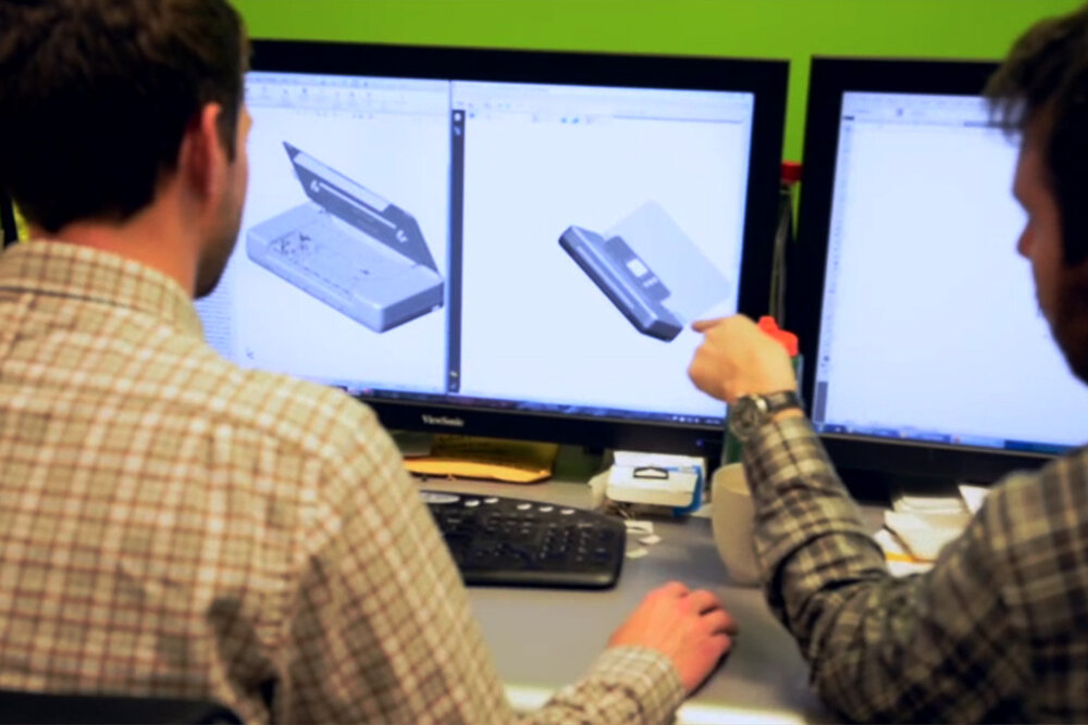 pdfact-men-at-computer Product Design and Development team working